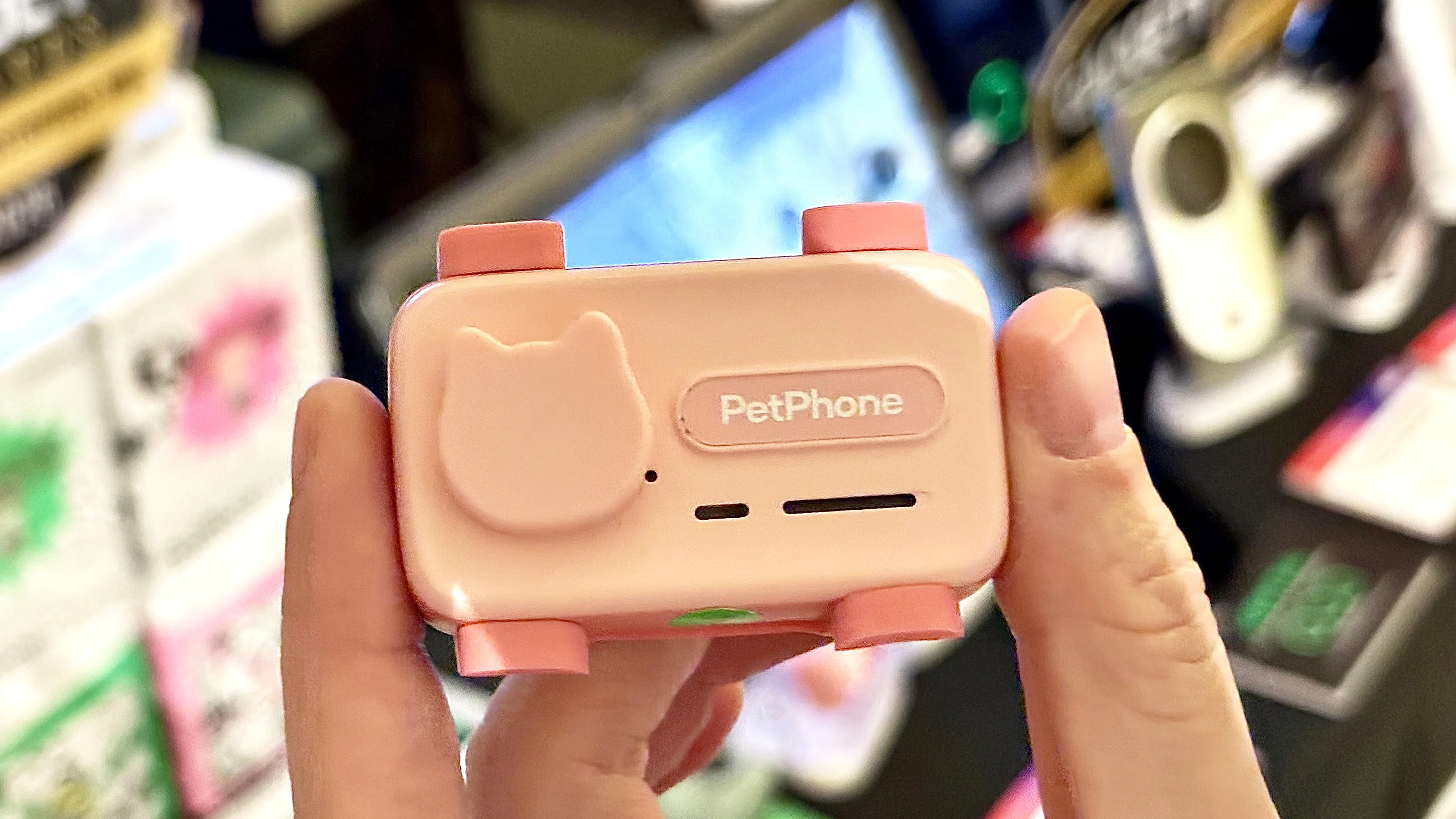 Close-up of the PetPhone, a wearable pet smartphone that attaches to a collar 